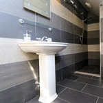 modern bathroom with sink toilet and shower