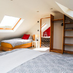 single bed and bathroom door