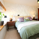 double bedroom with window and wardrobe