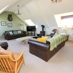 large lounge with three leather sofas