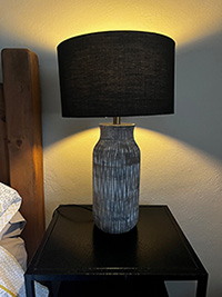 bedside lamp with a black lampshade